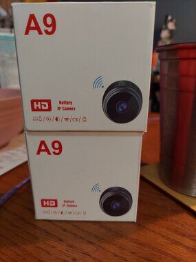 Mini security cameras/New in box